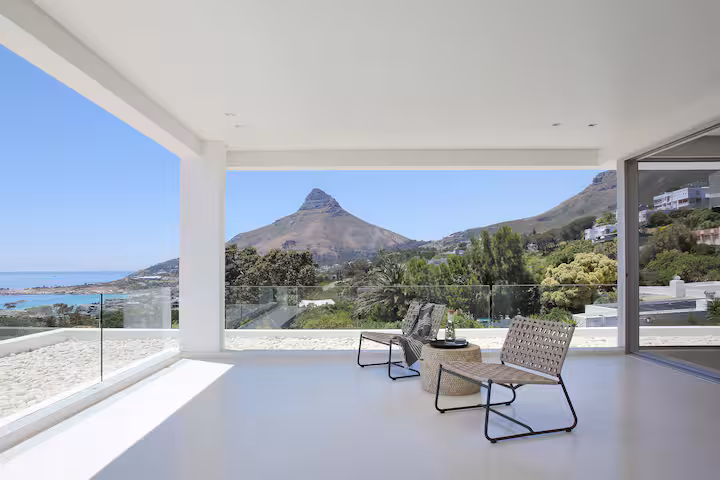 A living room opened completely to Lion's Head, two chairs facing it
